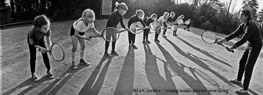 Group of young tennis players being coached, 1976